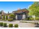 Stunning modern home featuring well-manicured landscaping and a private gated entrance at 9 Greely Club Trl, Henderson, NV 89052