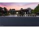 Elegant home at dusk with landscape lighting and manicured greenery at 9 Greely Club Trl, Henderson, NV 89052