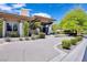Charming home with a well-maintained front exterior, showcasing mature trees and manicured landscaping at 9 Greely Club Trl, Henderson, NV 89052