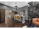 Stylish game room with a bar, leather chairs, wood paneling, and a spiral staircase at 9 Greely Club Trl, Henderson, NV 89052