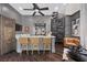 Modern entertainment room with wet bar, spiral staircase and stylish decor at 9 Greely Club Trl, Henderson, NV 89052