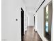 Hallway with hardwood floors and a view of the pool at 9 Greely Club Trl, Henderson, NV 89052