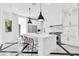 Bright kitchen featuring a center island, marble floors, and modern pendant lighting at 9 Greely Club Trl, Henderson, NV 89052