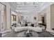 Airy living room boasting high ceilings, chic decor, and seamless access to the gourmet kitchen at 9 Greely Club Trl, Henderson, NV 89052