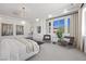 Serene main bedroom with plush seating and large windows offering scenic views at 9 Greely Club Trl, Henderson, NV 89052