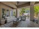 Comfortable outdoor living space featuring stylish seating and calming greenery at 9 Greely Club Trl, Henderson, NV 89052