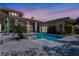 Backyard pool with spa showcasing the backyard of the home at twilight at 9 Greely Club Trl, Henderson, NV 89052
