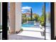 Pool and backyard viewed from inside the home, highlighting the seamless indoor/outdoor living at 9 Greely Club Trl, Henderson, NV 89052