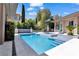 Backyard pool and spa combo with an outdoor kitchen at 9 Greely Club Trl, Henderson, NV 89052