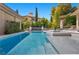Sparkling pool and spa featuring a waterfall feature and beautiful landscaping at 9 Greely Club Trl, Henderson, NV 89052