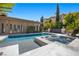 Beautiful pool and spa area with steps leading into the pool and a tanning deck at 9 Greely Club Trl, Henderson, NV 89052
