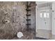 Stylish shower featuring marble walls, modern fixtures, and a built-in bench at 9 Greely Club Trl, Henderson, NV 89052