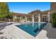 Stunning backyard pool and patio area perfect for relaxation and entertainment at 9 Greely Club Trl, Henderson, NV 89052