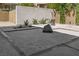 Zen rock garden featuring large stone and trimmed shrubs at 9 Greely Club Trl, Henderson, NV 89052
