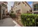 Landscaped backyard patio with fencing and lush shrubbery, perfect for outdoor enjoyment at 9173 Whitekirk Pl, Las Vegas, NV 89145