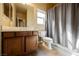 Bathroom with vanity, toilet, and shower with curtain at 9173 Whitekirk Pl, Las Vegas, NV 89145