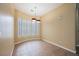 Cozy dining room with unique windows and ample space for entertaining guests at 9173 Whitekirk Pl, Las Vegas, NV 89145