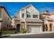 Charming two-story home featuring stone accents, a two-car garage, and manicured landscaping at 9173 Whitekirk Pl, Las Vegas, NV 89145