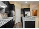 Modern kitchen features a gas range, stainless steel appliances, and a functional layout at 9173 Whitekirk Pl, Las Vegas, NV 89145