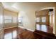 Open living room with hardwood floors, decorative fireplace, and adjacent space for dining and entertaining at 9173 Whitekirk Pl, Las Vegas, NV 89145