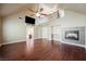 Spacious living room with vaulted ceiling, fireplace and adjoining sitting area at 9173 Whitekirk Pl, Las Vegas, NV 89145