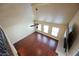 Loft area features hardwood flooring, a ceiling fan, and lots of windows at 9173 Whitekirk Pl, Las Vegas, NV 89145