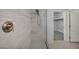 Modern bathroom featuring tiled shower stall and access to walk-in closet at 9370 Burning Sage Ave, Las Vegas, NV 89149