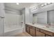 Bathroom featuring a tub, shower, vanity, and tile flooring at 9370 Burning Sage Ave, Las Vegas, NV 89149