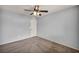 Bedroom with neutral carpet, light gray walls, ceiling fan and one door at 9370 Burning Sage Ave, Las Vegas, NV 89149