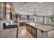 Spacious kitchen featuring stainless steel appliances, large island, and wooden cabinets at 9370 Burning Sage Ave, Las Vegas, NV 89149