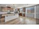 Well-lit kitchen with a center island, stainless steel appliances, and light countertop at 9370 Burning Sage Ave, Las Vegas, NV 89149