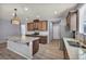 Well-lit kitchen featuring an island, stainless steel appliances, and ample cabinet space at 9370 Burning Sage Ave, Las Vegas, NV 89149