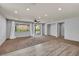 Spacious living area with recessed lighting, neutral walls, and a sliding glass door at 9370 Burning Sage Ave, Las Vegas, NV 89149