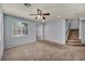 Inviting living space with neutral tones, staircase access, and plenty of natural light at 9370 Burning Sage Ave, Las Vegas, NV 89149