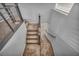 View down the staircase featuring carpeted steps and a metal railing at 9370 Burning Sage Ave, Las Vegas, NV 89149