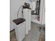 Utility room featuring a water filtration system, water heater, and modern flooring at 9370 Burning Sage Ave, Las Vegas, NV 89149