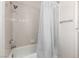 Shower and bathtub combination with chrome fixtures and tiled wall at 1185 Ponce De Leon Ave, Las Vegas, NV 89123