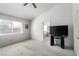 Bedroom features carpet floors, a TV, and a doorway to the bathroom at 1185 Ponce De Leon Ave, Las Vegas, NV 89123