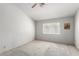 Spacious bedroom features carpet floors, ceiling fan, and a picture window at 1185 Ponce De Leon Ave, Las Vegas, NV 89123