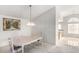 Bright dining area with carpet floors and neutral walls next to the kitchen at 1185 Ponce De Leon Ave, Las Vegas, NV 89123