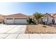 Charming single-story home featuring a three car garage and desert landscaping at 1185 Ponce De Leon Ave, Las Vegas, NV 89123