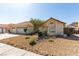 Exterior view of a charming single-story home featuring desert landscaping and a 3-car garage at 1185 Ponce De Leon Ave, Las Vegas, NV 89123