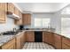 Kitchen features a granite countertop, stainless steel appliances, and wooden cabinets at 1185 Ponce De Leon Ave, Las Vegas, NV 89123