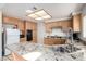 Kitchen features a granite countertop, double basin sink, and matching stainless appliances at 1185 Ponce De Leon Ave, Las Vegas, NV 89123