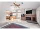 Bright living area with brick fireplace connects with kitchen, offering seamless entertaining and everyday living at 1185 Ponce De Leon Ave, Las Vegas, NV 89123