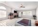 Open-concept living area featuring a brick fireplace, vaulted ceilings, and large windows for ample natural light at 1185 Ponce De Leon Ave, Las Vegas, NV 89123