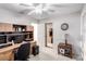 Office space with built-in shelves, desk, carpet flooring and a large window at 1185 Ponce De Leon Ave, Las Vegas, NV 89123