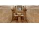 Elegant bathroom showcasing a unique stone sink and decorative tile accents at 1450 Rancho Cir, Las Vegas, NV 89107