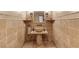 Stylish bathroom featuring a stone vessel sink, stone pedestal, and decorative tile at 1450 Rancho Cir, Las Vegas, NV 89107
