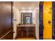 Bathroom featuring custom vanity, vessel sink, and walk-in shower with colorful tile accents at 1450 Rancho Cir, Las Vegas, NV 89107